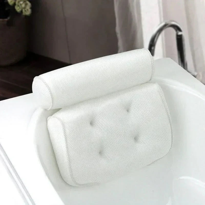 Cojín ergonómico para baño que proporciona soporte para el cuello y la cabeza en la bañera.