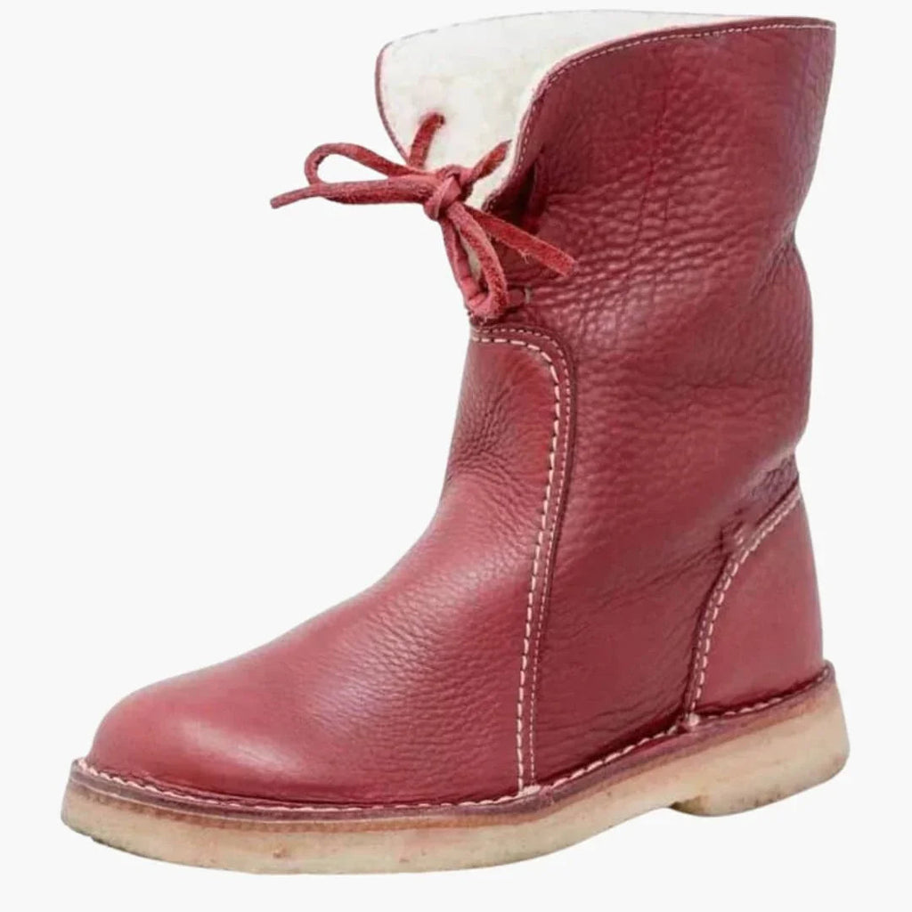 Botas de mujer con caña de altura media, cierre de cordones y superficie texturizada.