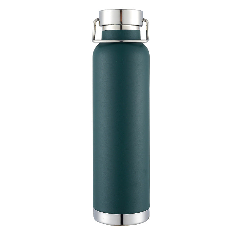 Botella de agua de acero inoxidable con doble pared y aislamiento al vacío, con tapa de transporte con cierre giratorio.