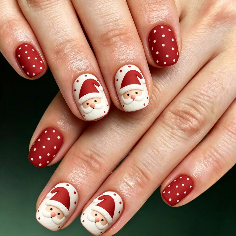 Diseño de uñas festivo con temática de Papá Noel