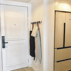 Perchero de pared de hierro fundido negro con diseño ondulado para recibidor, dormitorio o baño