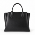 Bolso tote negro de piel sintética con asas.