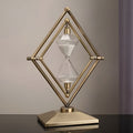 Reloj de arena con estructura geométrica de metal – Temporizador de meditación con arena blanca