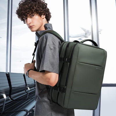 Mochila de viaje impermeable expandible 26–45 L con funda para portátil y opción de bolsa de deporte