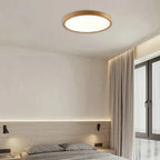 Lámpara de techo circular moderna con iluminación LED ajustable en acabado nogal cálido para sala de estar y dormitorio.