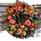 Corona otoñal de flores y calabazas