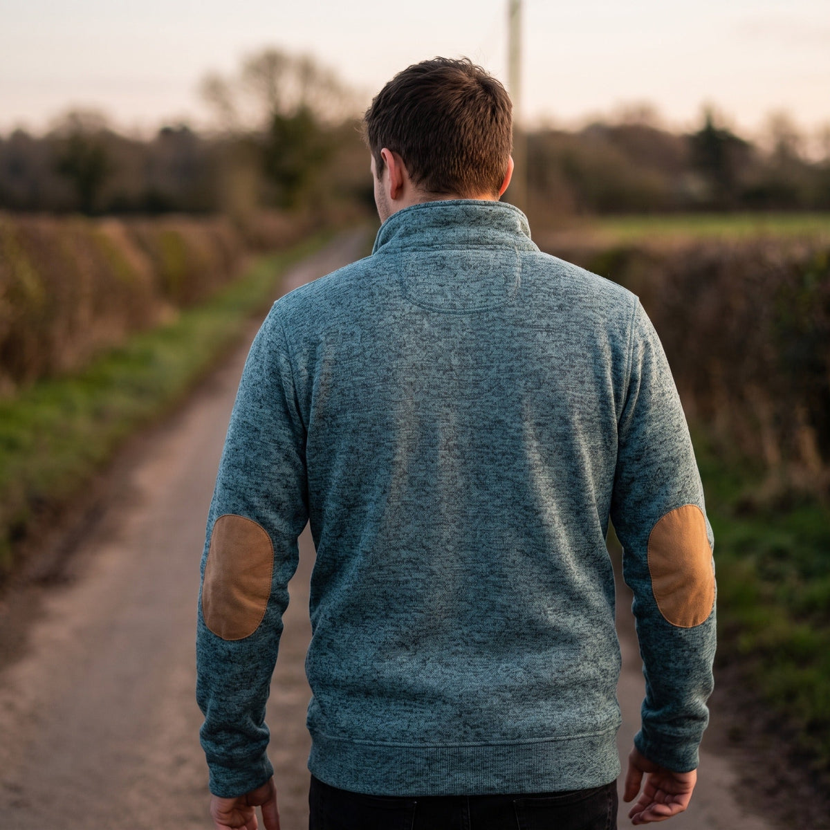 Jersey de punto con cuello alto y botonadura para hombre