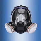 Máscara respiratoria completa con visor transparente y cartuchos de filtro intercambiables