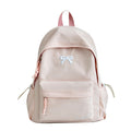 Mochila escolar casual con lazo en relieve, resistente al agua, tirantes acolchados