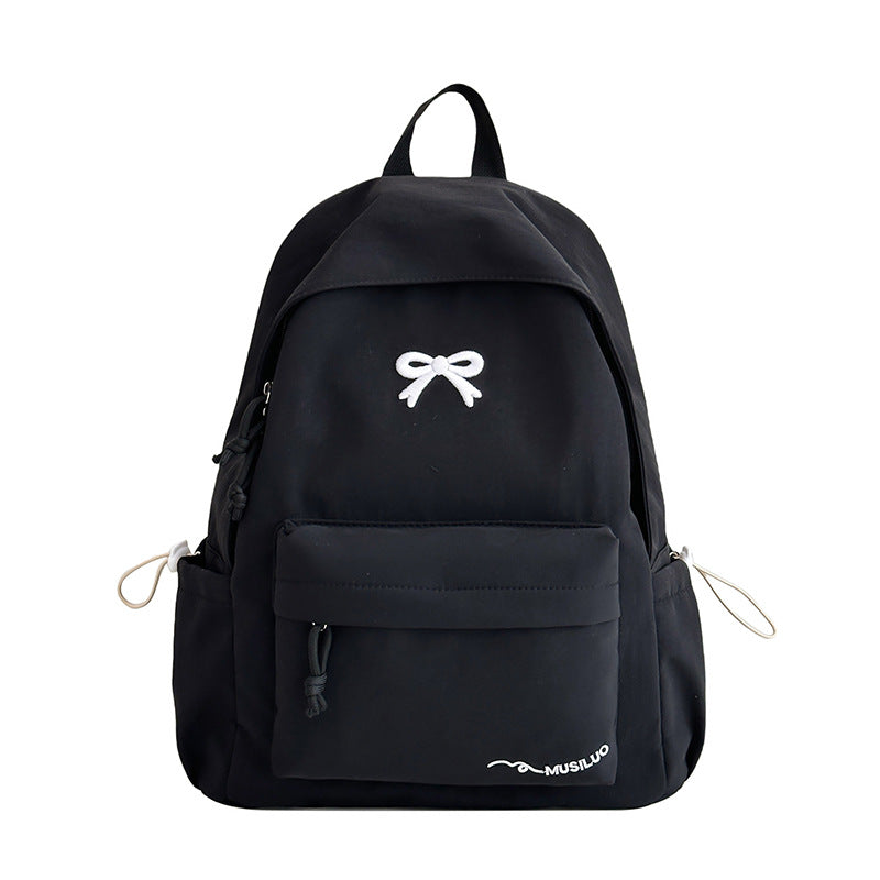 Mochila escolar casual con lazo en relieve, resistente al agua, tirantes acolchados