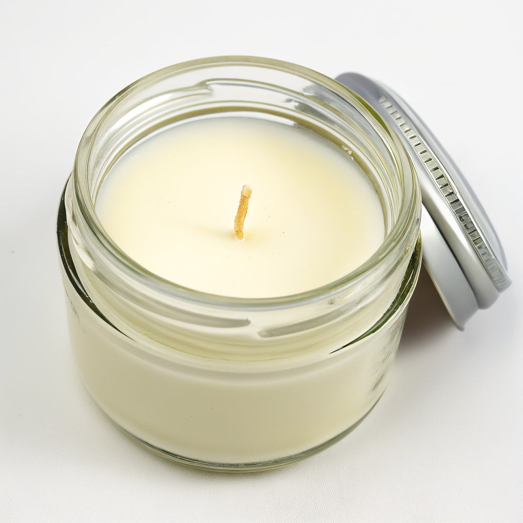 Vela de soja con aroma a verbena de limón en tarro de cristal transparente