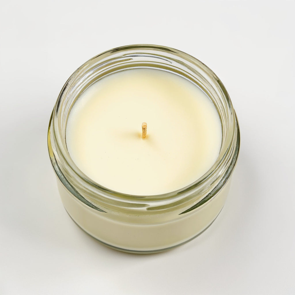 Vela de soja con aroma a verbena de limón en tarro de cristal transparente